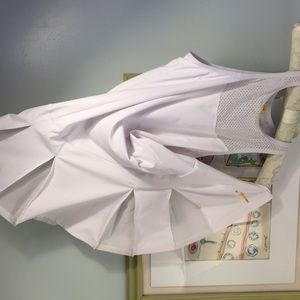 “Lole “ fitted tennis dress with pleated skirt.